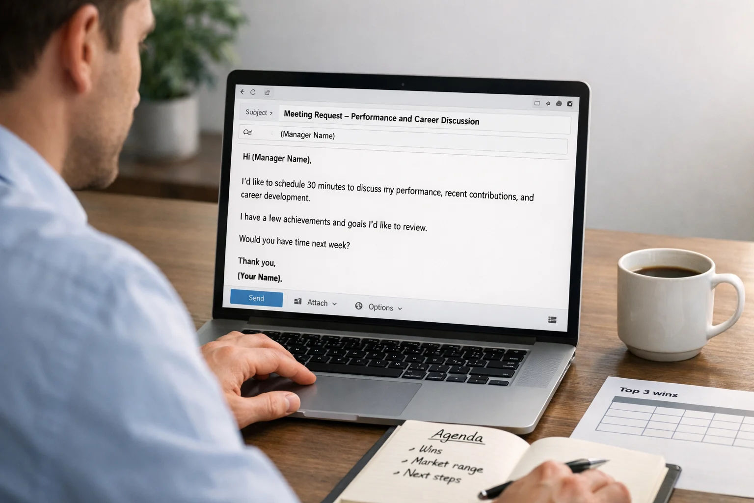 Person drafting a performance meeting request email on a laptop, agenda notes and a 'top 3 wins' sheet nearby